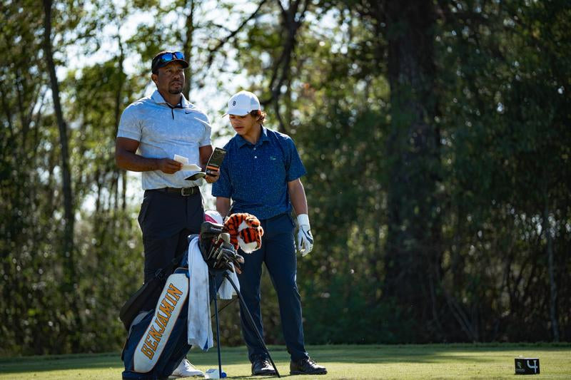 Image of Tiger and Charlie Woods - Sun Day Red
